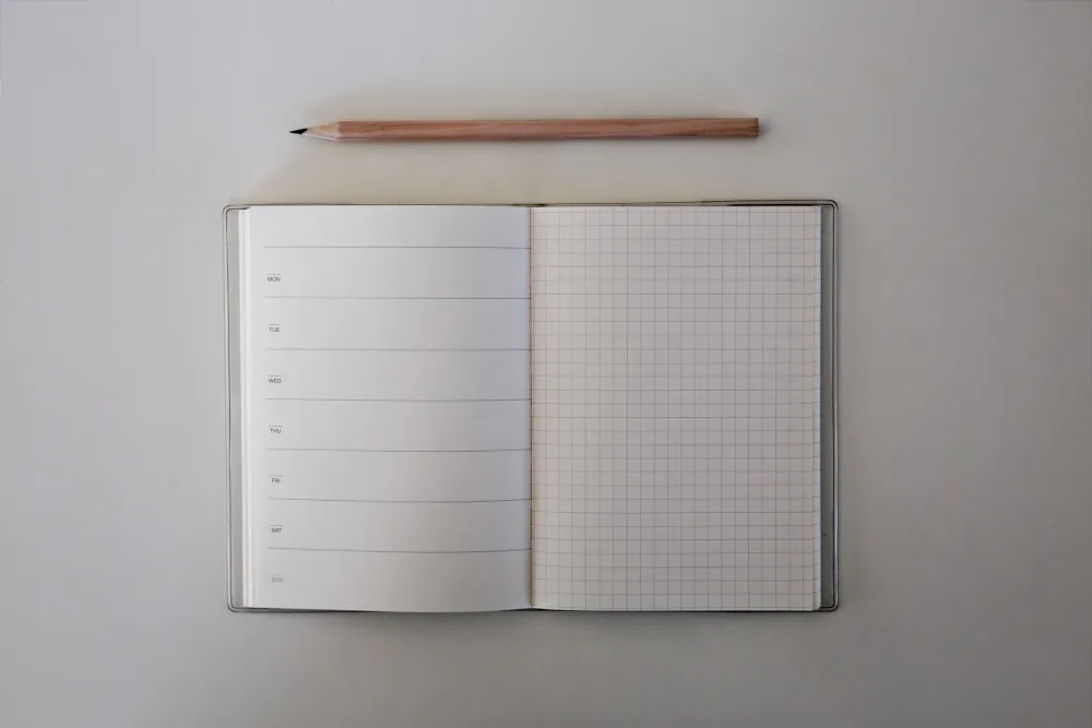 graphing journal and pencil resting on a table